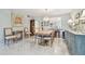Charming dining space with modern chandelier and a glimpse of the nearby, gourmet kitchen at 3505 Tarpon Woods Blvd # P404, Palm Harbor, FL 34685