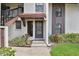Charming entryway with tile roof, muted colors, and landscaped surroundings welcomes you home at 3505 Tarpon Woods Blvd # P404, Palm Harbor, FL 34685