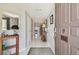 Entry hallway with a wooden console table and views of the home's interior at 3505 Tarpon Woods Blvd # P404, Palm Harbor, FL 34685
