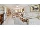 Bright living room with chandelier and an open view of the dining room at 3505 Tarpon Woods Blvd # P404, Palm Harbor, FL 34685