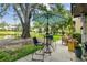Patio space with seating and outdoor views of a lake and landscaping at 3505 Tarpon Woods Blvd # P404, Palm Harbor, FL 34685