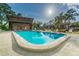 Enjoy the community pool with lounge chairs and a spacious pool house under the Florida sun at 3505 Tarpon Woods Blvd # P404, Palm Harbor, FL 34685