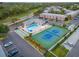 Overhead of community pool, shuffleboard, tennis court, clubhouse, landscaping, and parking at 3580 38Th S Ave # 95, St Petersburg, FL 33711