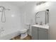 Modern bathroom with a combo tub and shower, vanity with storage, and wood-look flooring at 3580 38Th S Ave # 95, St Petersburg, FL 33711