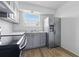 Bright kitchen features stainless appliances and gray cabinets at 3580 38Th S Ave # 95, St Petersburg, FL 33711