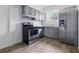 Updated kitchen features stainless steel appliances and gray cabinets at 3580 38Th S Ave # 95, St Petersburg, FL 33711