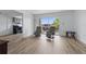 Open living space with new floors and sliding glass doors to the balcony at 3580 38Th S Ave # 95, St Petersburg, FL 33711