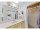 Bathroom with a single vanity sink and walk-in shower at 37420 Teaberry Loop, Zephyrhills, FL 33542
