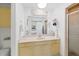 Bright bathroom with a single vanity sink and shower at 37420 Teaberry Loop, Zephyrhills, FL 33542
