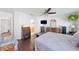 Spacious bedroom with a ceiling fan and view to a full bathroom at 37420 Teaberry Loop, Zephyrhills, FL 33542