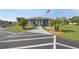 Inviting clubhouse with an American flag, lush landscaping and ample parking, ideal for community gatherings at 37420 Teaberry Loop, Zephyrhills, FL 33542