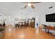 Open-concept dining area with beautiful wood floors, traditional furnishings, and ample space for entertaining at 37420 Teaberry Loop, Zephyrhills, FL 33542