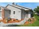 Well-maintained home featuring neutral siding, a manicured lawn, and decorative landscaping at 37420 Teaberry Loop, Zephyrhills, FL 33542
