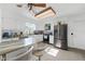 Bright kitchen featuring white cabinetry, stainless steel appliances, granite countertops and eat in breakfast bar at 37420 Teaberry Loop, Zephyrhills, FL 33542