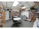 A spacious library is lined with bookshelves and features tables for reading and hobbies at 37420 Teaberry Loop, Zephyrhills, FL 33542
