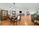 Open-concept living and dining area with hardwood floors, ample natural light and neutral paint tones at 37420 Teaberry Loop, Zephyrhills, FL 33542