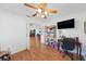 Office space features a ceiling fan and natural light at 37420 Teaberry Loop, Zephyrhills, FL 33542