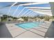 Bright, covered community pool with ample lounging space, perfect for residents to enjoy a refreshing swim at 37420 Teaberry Loop, Zephyrhills, FL 33542
