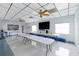 Large recreation area with a television and tables, perfect for community events and activities at 37420 Teaberry Loop, Zephyrhills, FL 33542