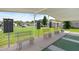 The community offers shuffleboard courts and seating for those waiting to play at 37420 Teaberry Loop, Zephyrhills, FL 33542