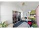 Relaxing sunroom featuring sliding glass doors to the backyard and comfortable seating arrangements at 37420 Teaberry Loop, Zephyrhills, FL 33542
