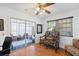 Cozy sunroom with comfortable seating, offering a bright and relaxing space for enjoying the outdoors at 37420 Teaberry Loop, Zephyrhills, FL 33542