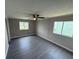 Bright bedroom with neutral walls, hardwood floors, and closet at 37832 Madeira Ave, Zephyrhills, FL 33541