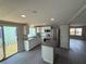 Updated kitchen with stainless steel appliances, granite counters, and center island at 37832 Madeira Ave, Zephyrhills, FL 33541