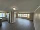 Open-concept living room featuring updated flooring and lots of natural light at 37832 Madeira Ave, Zephyrhills, FL 33541