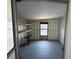 Functional utility room featuring convenient shelving, ready for storage and practical tasks at 37832 Madeira Ave, Zephyrhills, FL 33541