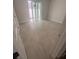Tiled bedroom features a sliding glass door and neutral colors for a relaxing ambiance at 4208 W Carmen St # C, Tampa, FL 33609