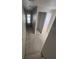 Bright hallway with an entry door leading to the outside and an adjacent unfinished doorway at 4208 W Carmen St # C, Tampa, FL 33609