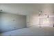 A large, unfinished living room with neutral walls and natural lighting from windows at 4208 W Carmen St # C, Tampa, FL 33609