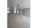 Spacious, unfinished living room with ample natural light from windows at 4208 W Carmen St # C, Tampa, FL 33609