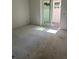 Unfinished room featuring a sliding glass door leading to a backyard area at 4208 W Carmen St # C, Tampa, FL 33609