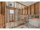 Exposed framing in bathroom with window at 4221 Burrows Rd, Zephyrhills, FL 33542