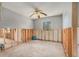 Bedroom with exposed framing, a ceiling fan, and a window at 4221 Burrows Rd, Zephyrhills, FL 33542