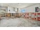 A bright garage space with unfinished walls and an electrical panel at 4221 Burrows Rd, Zephyrhills, FL 33542