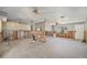 Large open-concept living area with multiple ceiling fans, ready for remodeling at 4221 Burrows Rd, Zephyrhills, FL 33542