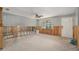 Spacious living room undergoing renovation, featuring bare framing and ample natural light at 4221 Burrows Rd, Zephyrhills, FL 33542