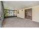 Covered patio featuring stained concrete and doors leading to the interior of the house at 4221 Burrows Rd, Zephyrhills, FL 33542