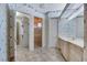 Bathroom featuring walk-in closet, large vanity, and glass enclosed shower at 4641 John Moore Rd, Brandon, FL 33511