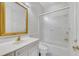 Traditional bathroom with white vanity, gold hardware, and shower featuring sliding glass doors at 4641 John Moore Rd, Brandon, FL 33511