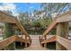A wood dock extends out to calm waters, framed by trees at 4641 John Moore Rd, Brandon, FL 33511