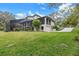 Exterior view of a spacious lawn and two-story screened in patio at 4641 John Moore Rd, Brandon, FL 33511
