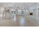 Spacious foyer featuring a sweeping staircase and tile flooring at 4641 John Moore Rd, Brandon, FL 33511