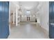 Grand foyer with soaring ceilings, large windows, and a stunning curved staircase at 4641 John Moore Rd, Brandon, FL 33511