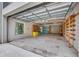 Spacious garage with high ceilings, storage, and a window at 4641 John Moore Rd, Brandon, FL 33511