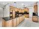 Spacious kitchen with granite countertops, wooden cabinets, and modern stainless appliances at 4641 John Moore Rd, Brandon, FL 33511