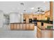 Bright kitchen with stone countertops, light wood cabinets and stainless steel appliances at 4641 John Moore Rd, Brandon, FL 33511